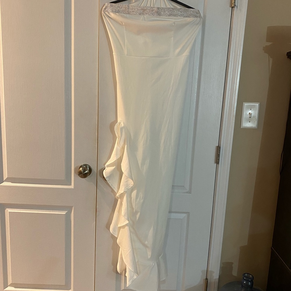 Ladies xl white gown with silver trimming across chest area